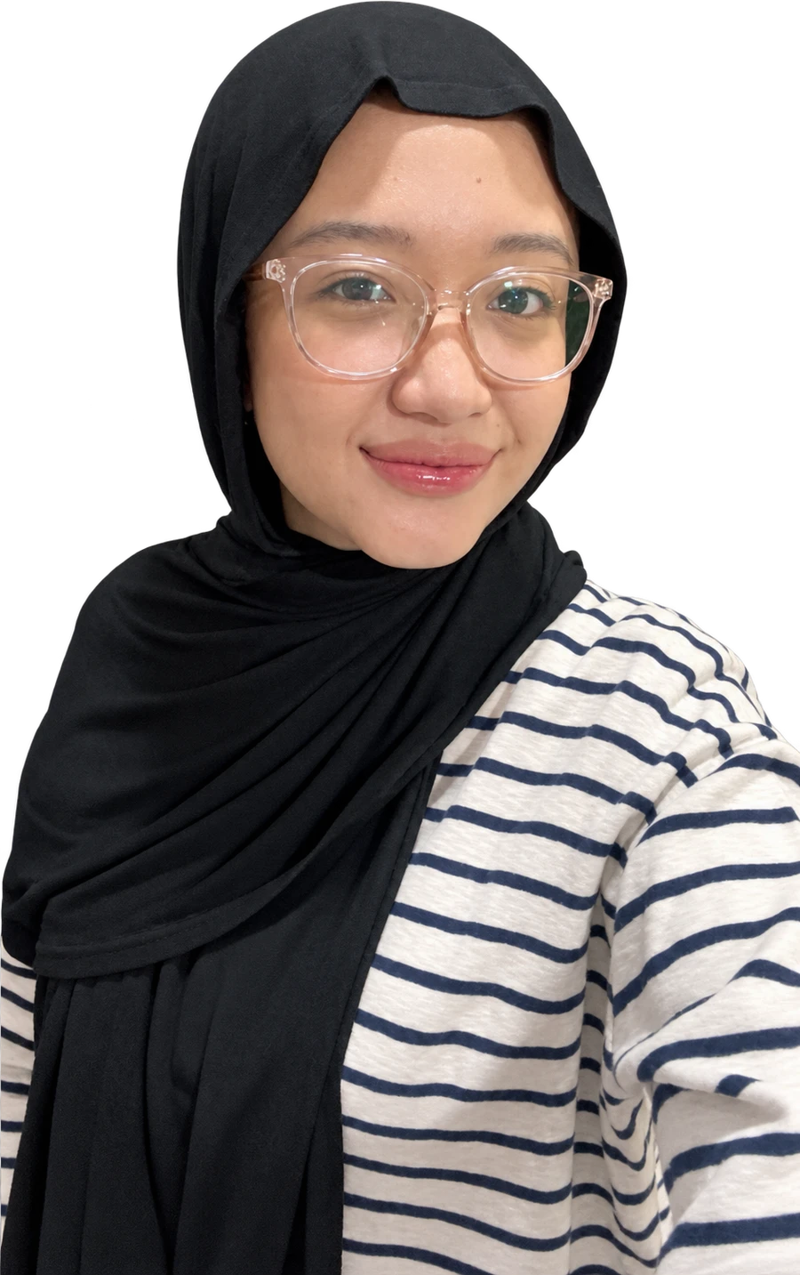 Caca smiling, wearing her glasses and black hijab